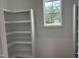 Brightly lit shelves with view through the window at 50 Leah Ln, Louisburg, NC 27549