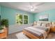 Inviting bedroom with natural light from the window, showcasing a comfortable sleeping space at 5124 Lazywood Ln, Durham, NC 27712