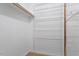 Spacious walk-in closet, complete with ample shelving for organized storage solutions at 5124 Lazywood Ln, Durham, NC 27712