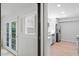 Stylish kitchen peek featuring white cabinets, stainless appliances and hardwood flooring at 5124 Lazywood Ln, Durham, NC 27712