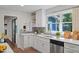 Well-lit kitchen featuring quartz countertops, gray tile backsplash, and stainless steel appliances at 5124 Lazywood Ln, Durham, NC 27712