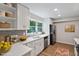 Bright kitchen features stainless steel appliances, granite countertops, and hardwood flooring at 5124 Lazywood Ln, Durham, NC 27712