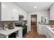 Updated kitchen boasts modern appliances, sleek countertops, and plenty of cabinet space at 5124 Lazywood Ln, Durham, NC 27712