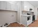 Updated kitchen area with stainless steel appliances, ample cabinets, and modern countertops at 5124 Lazywood Ln, Durham, NC 27712