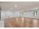 Large living room with hardwood floors and updated lighting, ideal for Gathering gatherings at 5124 Lazywood Ln, Durham, NC 27712