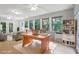 Large sunroom featuring a spacious office area with lots of light at 5124 Lazywood Ln, Durham, NC 27712