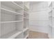 A walk-in closet with shelving to maximize storage space at 5124 Lazywood Ln, Durham, NC 27712