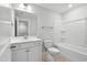 Well-lit bathroom with white vanity, framed mirror, toilet, and a shower-tub combination at 529 Forestville Rd, Wake Forest, NC 27587