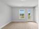 Bedroom with neutral carpet and an exterior door at 529 Forestville Rd, Wake Forest, NC 27587