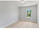 Simple bedroom with carpet and a window offering views of the outdoors at 529 Forestville Rd, Wake Forest, NC 27587