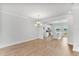 Dining area flows to the kitchen with white cabinets and a breakfast bar at 529 Forestville Rd, Wake Forest, NC 27587
