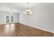 Bright dining area features a modern chandelier and french doors to the deck at 529 Forestville Rd, Wake Forest, NC 27587