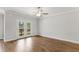 Living room with hardwood floors and french doors that open to an outdoor deck at 529 Forestville Rd, Wake Forest, NC 27587
