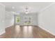 Spacious living room with hardwood floors and access to an outdoor deck at 529 Forestville Rd, Wake Forest, NC 27587