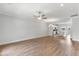 Open living room with hardwood floors that flows into the kitchen area at 529 Forestville Rd, Wake Forest, NC 27587