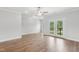 Open living room with hardwood floors and access to an outdoor deck at 529 Forestville Rd, Wake Forest, NC 27587