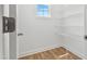 Pantry with white wire shelving and wood floor at 529 Forestville Rd, Wake Forest, NC 27587