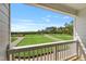 Balcony view of green space and street on a sunny day at 529 Forestville Rd, Wake Forest, NC 27587