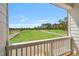 Balcony view of green space and street on a sunny day at 529 Forestville Rd, Wake Forest, NC 27587