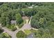 Wide aerial view of the property in a leafy neighborhood at 6205 Houndsman Ct, Raleigh, NC 27616