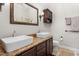 Bathroom showcasing double sinks with granite countertops, complementing the modern design at 6205 Houndsman Ct, Raleigh, NC 27616