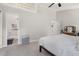 Bedroom with a neutral color scheme, featuring an adjoining bathroom and closet at 6205 Houndsman Ct, Raleigh, NC 27616