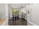 Cozy breakfast nook area with a chandelier and a view of the green backyard at 6205 Houndsman Ct, Raleigh, NC 27616