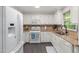 Traditional kitchen with white cabinetry, granite countertops, and stainless steel appliances at 6205 Houndsman Ct, Raleigh, NC 27616
