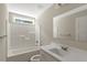 Bathroom with a single sink vanity, tub and shower at 7082 Cornwall Rd, Oxford, NC 27565