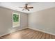Neutral bedroom featuring ceiling fan, good natural light, and neutral paint at 7082 Cornwall Rd, Oxford, NC 27565