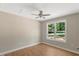 Bright bedroom with ceiling fan and large window at 7082 Cornwall Rd, Oxford, NC 27565