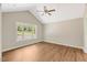 Spacious bedroom with large window and vaulted ceiling and wood-look floors at 7082 Cornwall Rd, Oxford, NC 27565