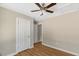 Neutral bedroom with ceiling fan, good natural light, wood-look floors, and neutral paint at 7082 Cornwall Rd, Oxford, NC 27565