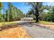 Charming home with a gravel driveway and beautiful lawn at 7082 Cornwall Rd, Oxford, NC 27565