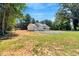 Well-kept home exterior featuring a manicured lawn and gravel driveway at 7082 Cornwall Rd, Oxford, NC 27565