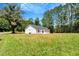 This is a home with white siding and a well manicured lawn at 7082 Cornwall Rd, Oxford, NC 27565