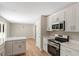 Modern kitchen featuring stainless steel appliances and white cabinetry at 7082 Cornwall Rd, Oxford, NC 27565
