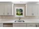 Bright kitchen sink and window view of the backyard at 7082 Cornwall Rd, Oxford, NC 27565