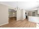 Bright living room featuring modern lighting, open floor plan, and neutral paint at 7082 Cornwall Rd, Oxford, NC 27565
