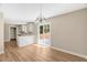 Open concept kitchen, neutral paint, wood-look floors, and ample natural light at 7082 Cornwall Rd, Oxford, NC 27565