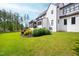 Expansive backyard with lush landscaping and a view of the rear exterior at 7304 Wexford Woods Ln, Wake Forest, NC 27587