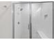 Modern walk-in shower with white subway tile and glass door at 7304 Wexford Woods Ln, Wake Forest, NC 27587