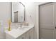 Bright bathroom featuring a white vanity with modern sink and a stylish rectangular mirror at 7304 Wexford Woods Ln, Wake Forest, NC 27587