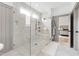 Luxurious bathroom with marble walk-in shower and frameless glass doors at 7304 Wexford Woods Ln, Wake Forest, NC 27587
