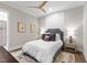 Comfortable bedroom with a ceiling fan, decorative pillows, lamps, and bedside tables at 7304 Wexford Woods Ln, Wake Forest, NC 27587
