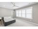 Spacious bedroom with neutral walls, large windows and a ceiling fan at 7304 Wexford Woods Ln, Wake Forest, NC 27587