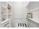 Closet with white shelving and drawers, and a window providing natural light at 7304 Wexford Woods Ln, Wake Forest, NC 27587