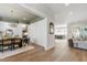 Open-concept dining area with hardwood floors and natural light throughout the home at 7304 Wexford Woods Ln, Wake Forest, NC 27587