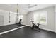 Home exercise room with full mirror and stationary bike at 7304 Wexford Woods Ln, Wake Forest, NC 27587