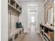 Hallway with custom storage cabinets, drawers, shelving and hooks with decor at 7304 Wexford Woods Ln, Wake Forest, NC 27587